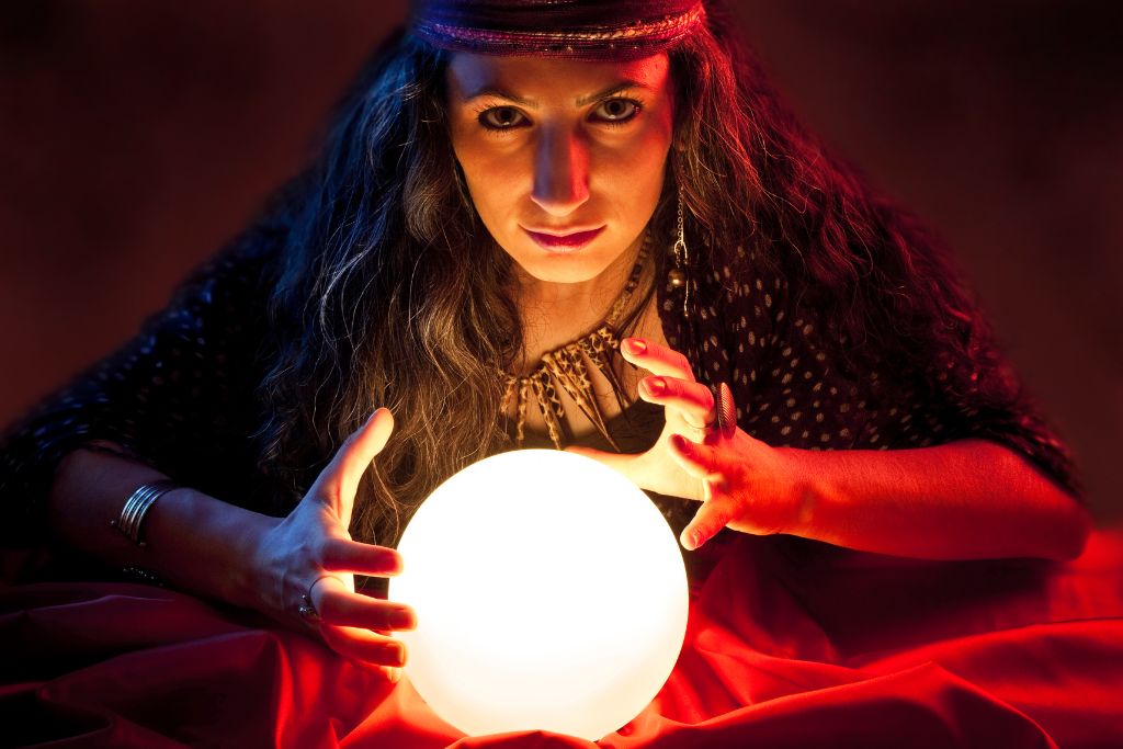 A woman is scrying a crystal ball