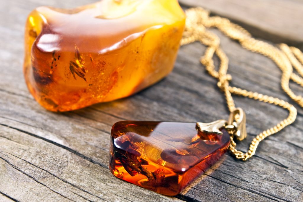 An Amber Necklace on a wooden table