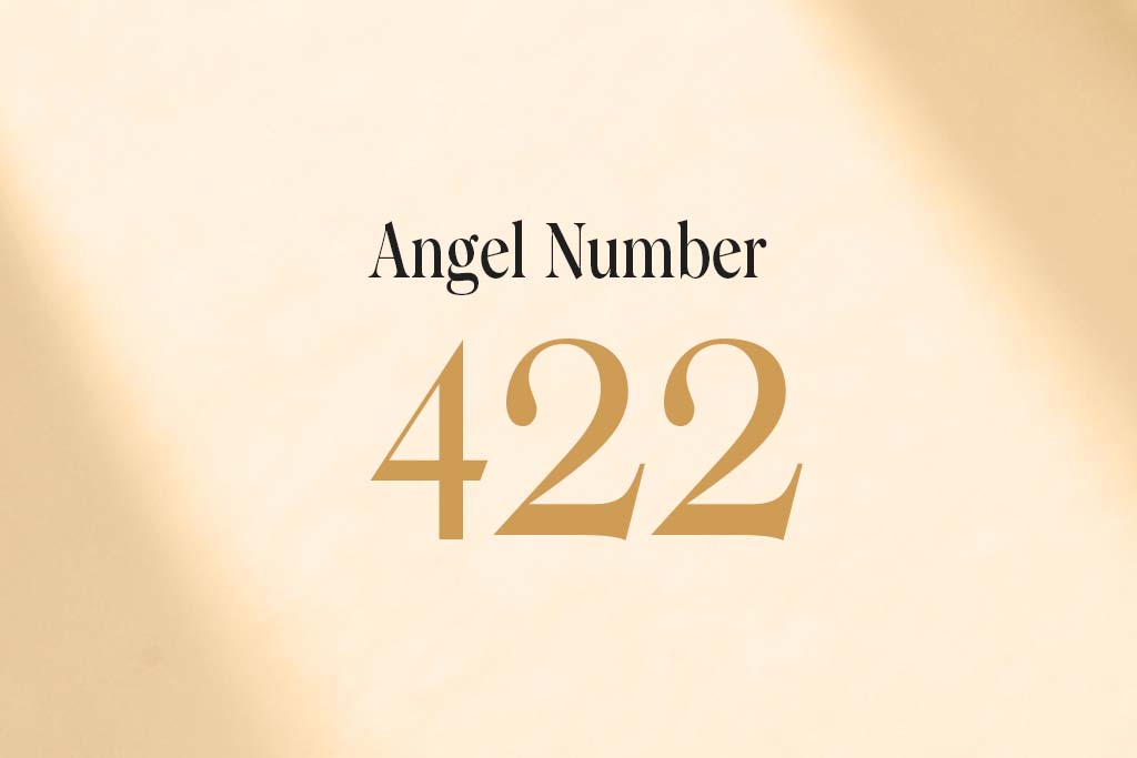 angel number 422 written on a beige background