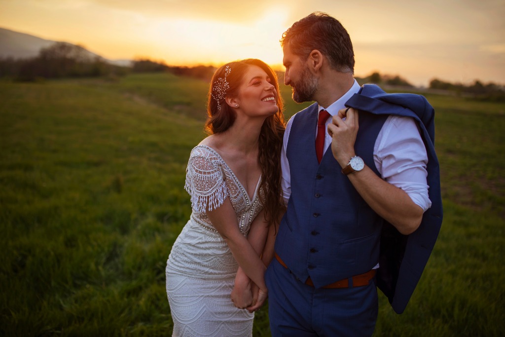 A bride and groom is looking at each other