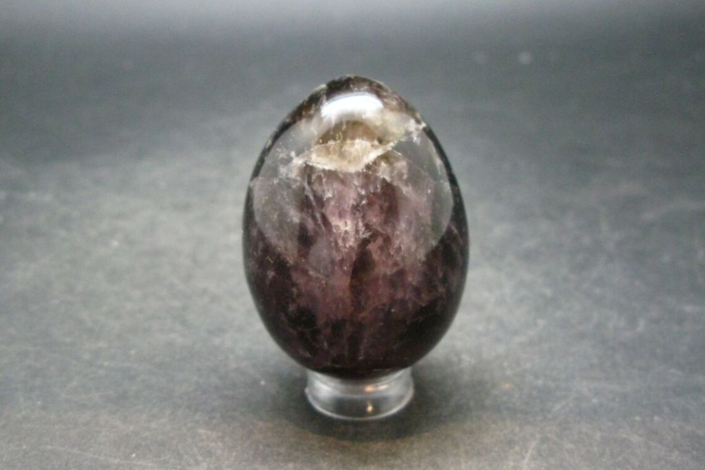 A Cacoxenite Egg on a dark background. Source: Etsy | TheGlobalStone