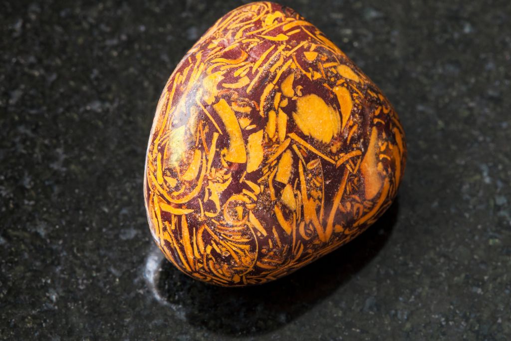 A Calligraphy Jasper on a black granite