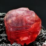 Cherry Red Rhodochrosite on a dark matrix