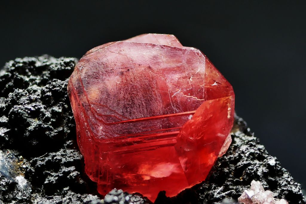 Cherry Red Rhodochrosite on a dark matrix