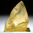 A copal crystal being lighted on a dark room