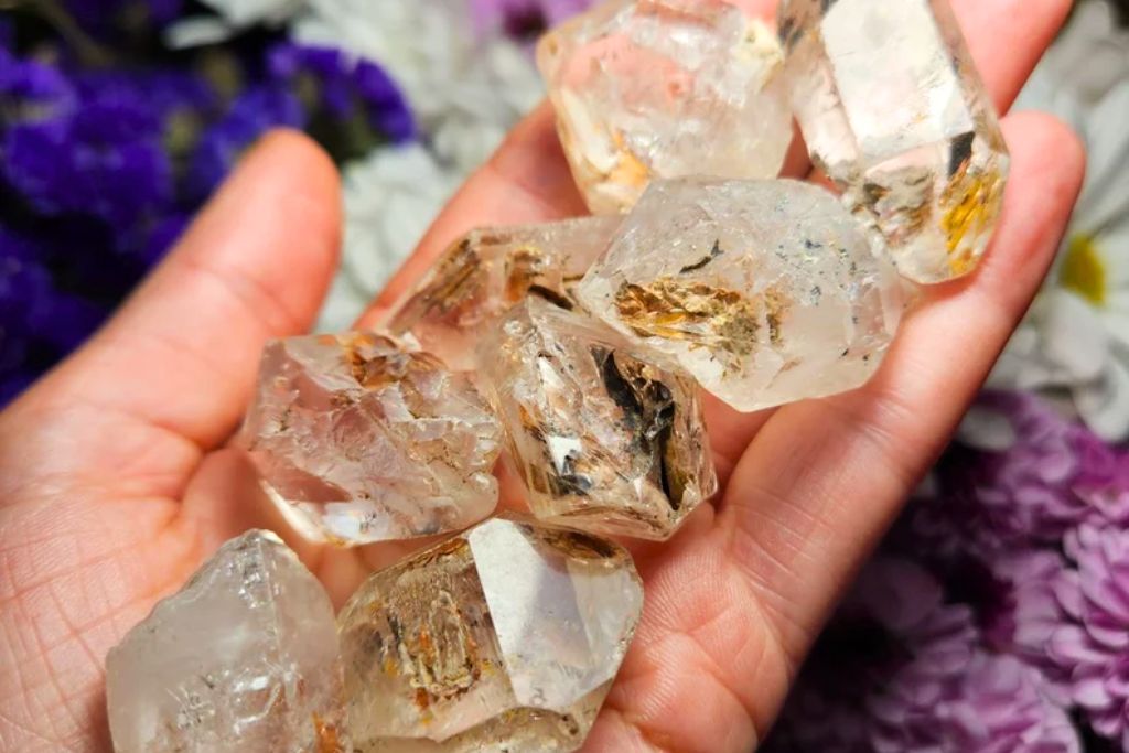 several Elestial Quartz placed on a woman's hand. Image Source: Elestial Quartz | Lauren-InfiniteSpiral