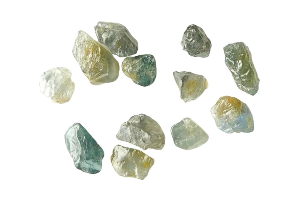 several chunks of Green Spinel Crystals on a white background