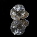 Herkimer Diamond on a black reflective background