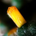 A Kasolite crystal on a crystal. Source: Wikimedia | Christian Rewitzer
