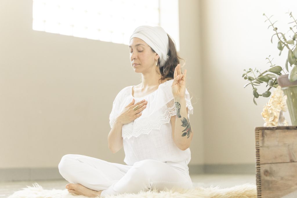 Woman practicing yoga with Lotus pose