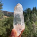 A person holding a Lemurian Seed Crystal. Source: Etsy | BodyBuzzShop