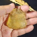 A person holding a libyan desert glass. Source: Etsy | Earth Craft