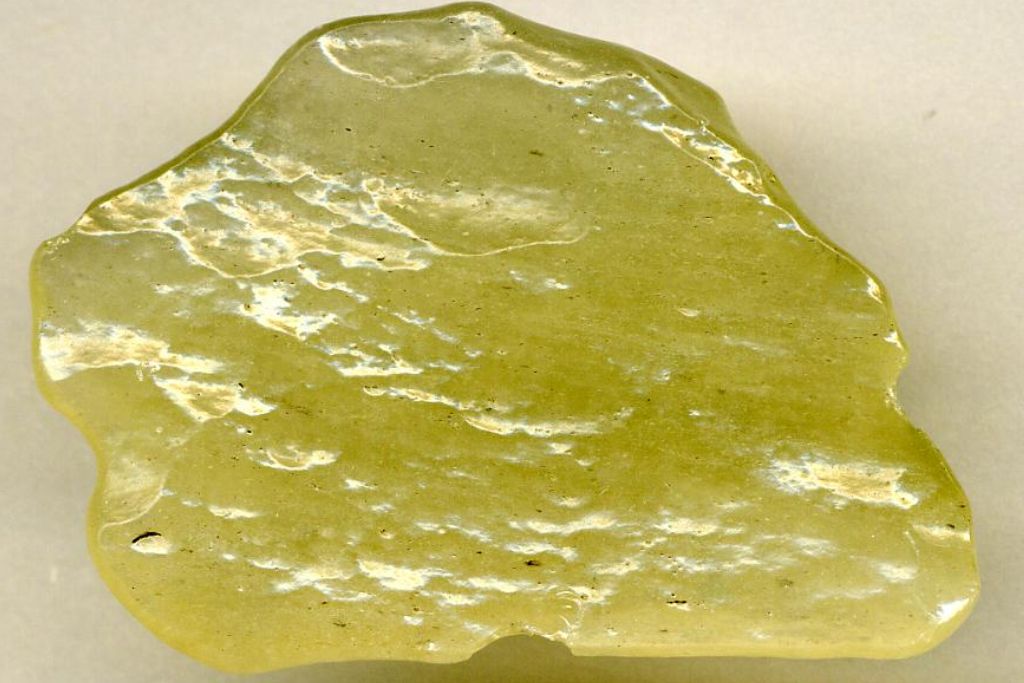 A libyan Desert Glass on a whitish background. Source: Wikimedia | James St. John