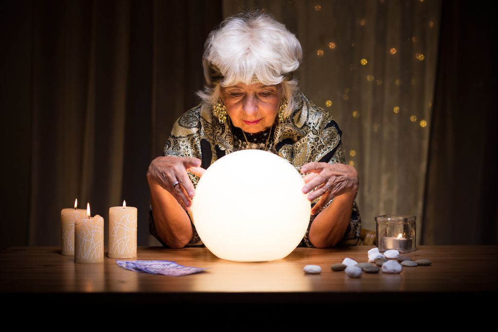 Female medium holding a crystal 