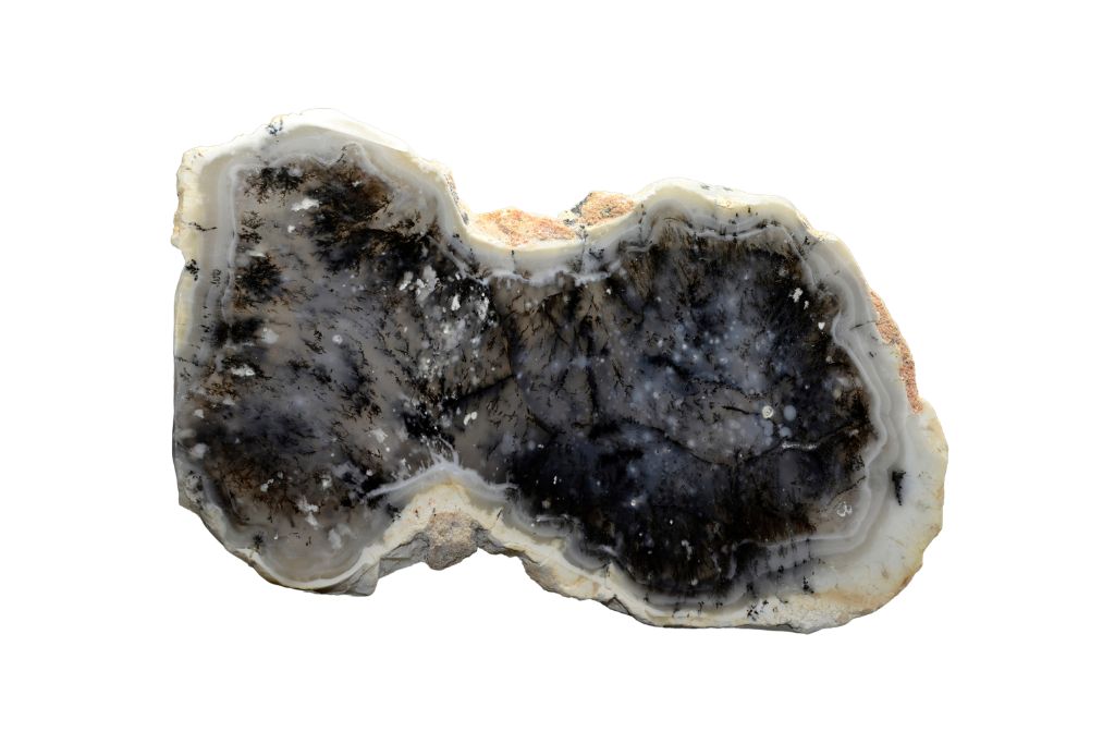 A raw merlinite crystal on a white background