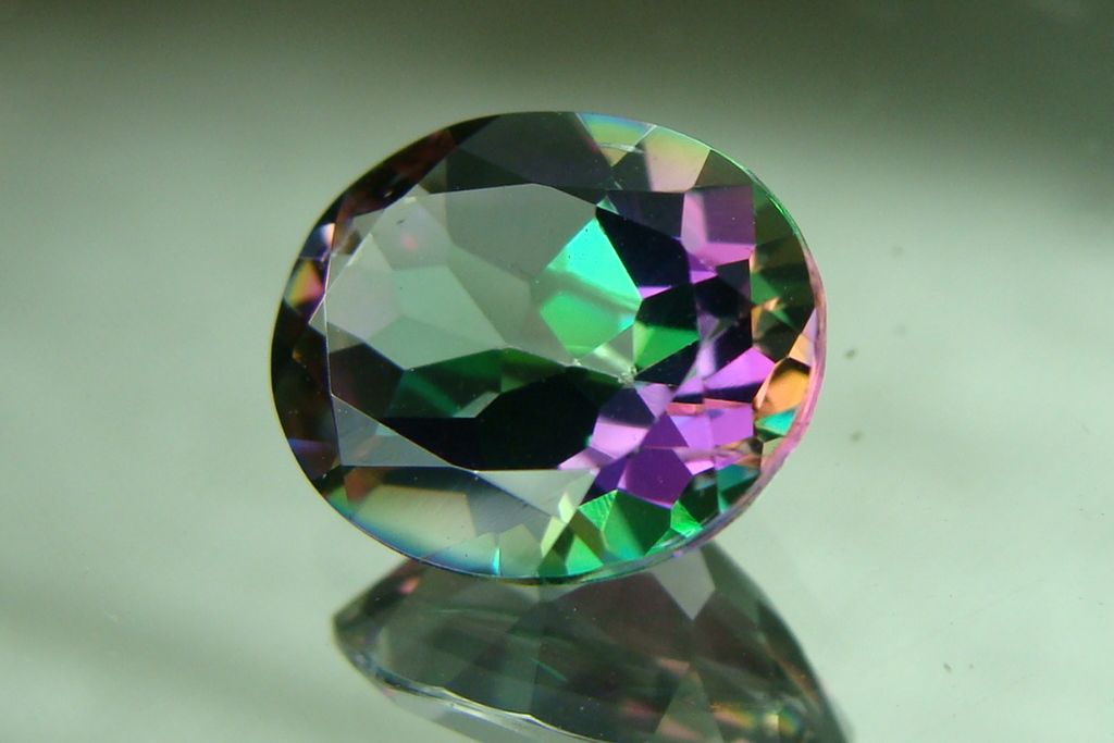 Mystic Topaz on a light green background