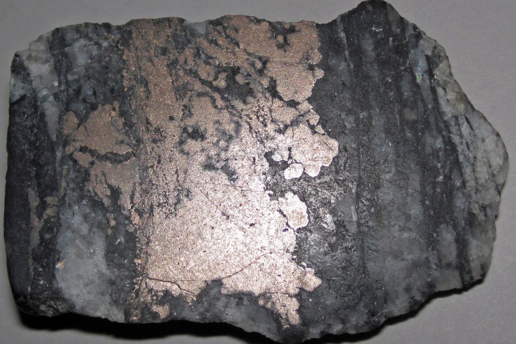 A Nickeline (Niccolite) on a whitish background. Source: Flickr | James St. John