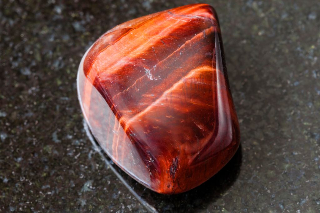 Ox's Eye(RedTiger Eye, Bulls Eye) on a black granite