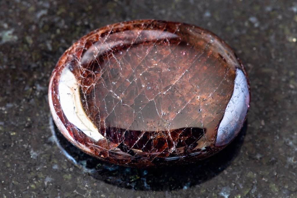 Pyrope Garnet on a black granite