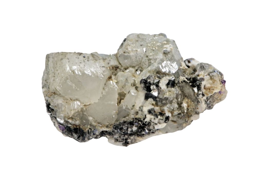 A Raw phenakite on a white background