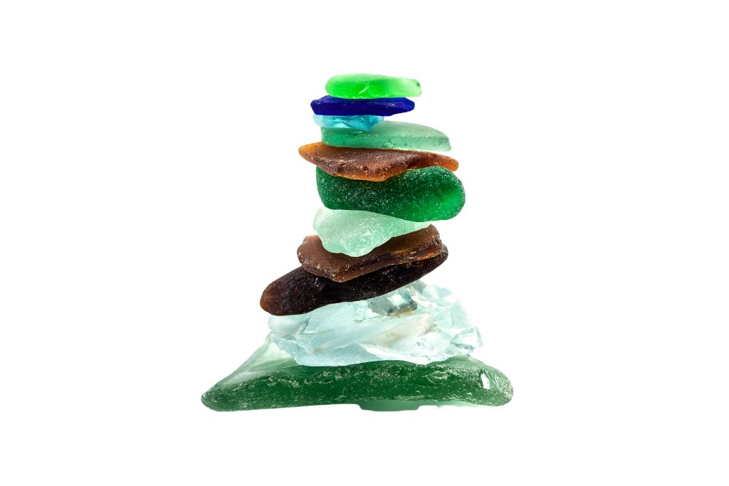 A stack of sea glass crystal on a white background