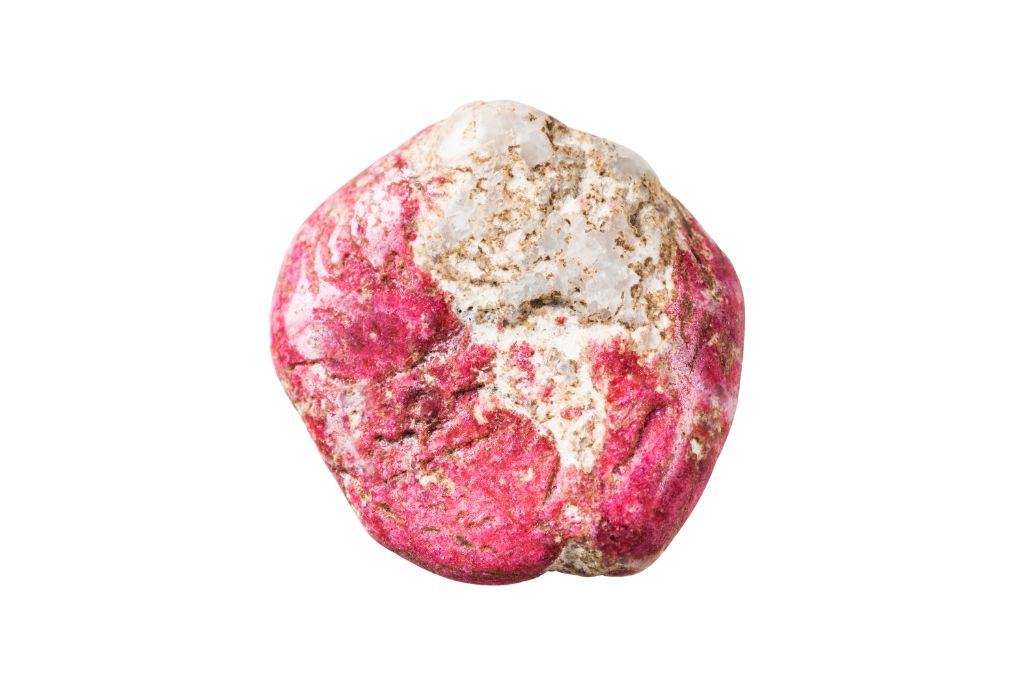 A Thulite crystal on a white background