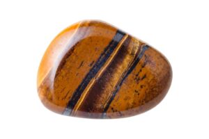 A polished tiger's eye crystal on a white background.