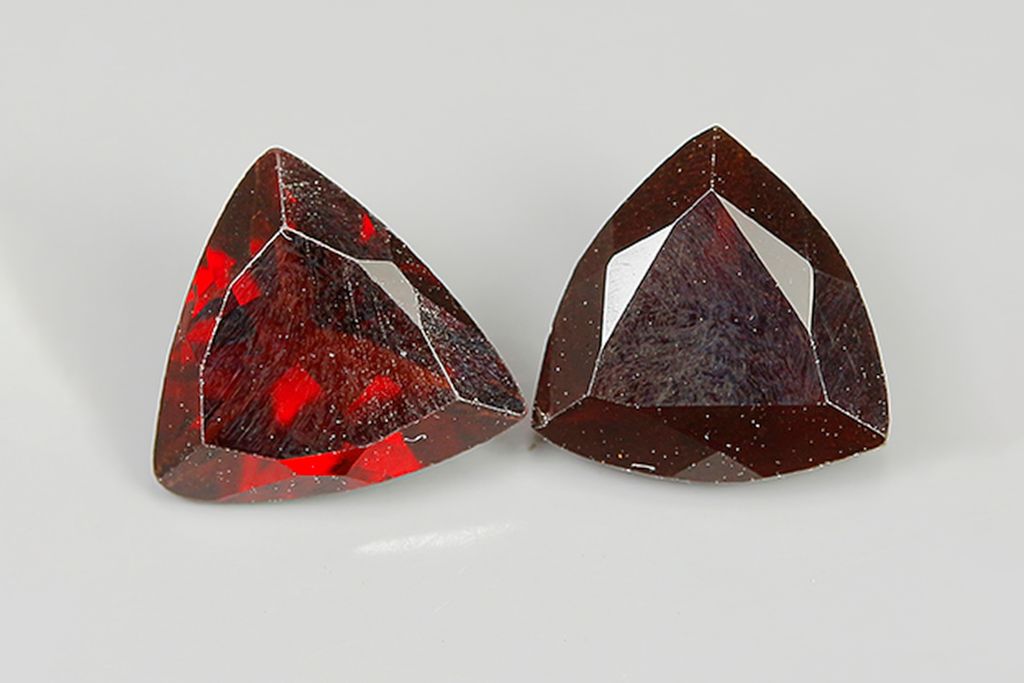 2 almandine garnet on a gray background