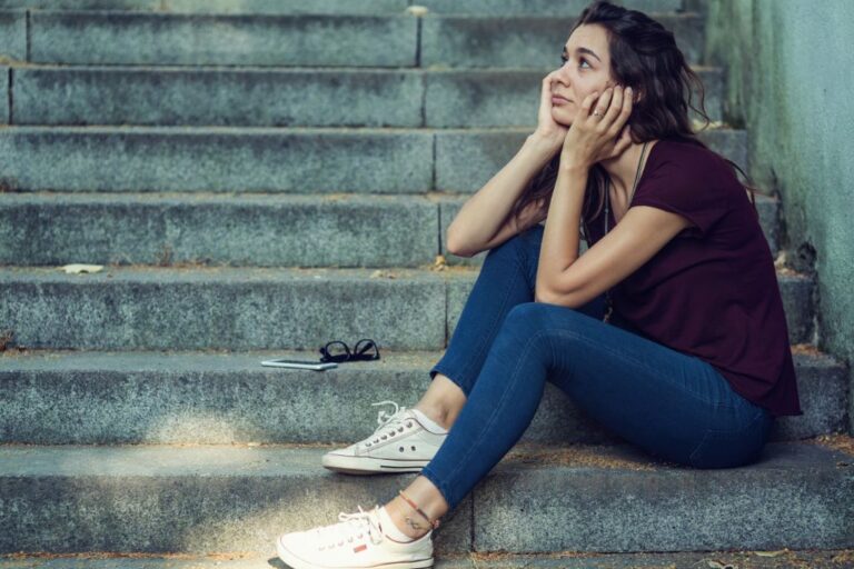 woman sitting down the stair case