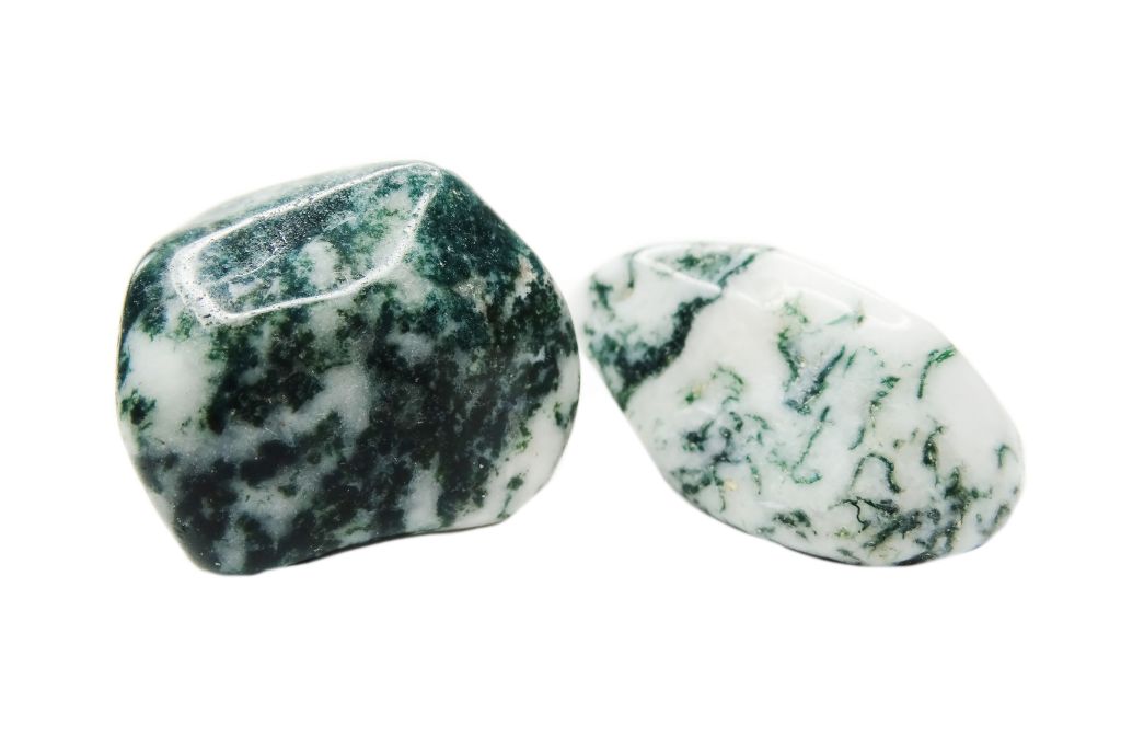 two sweet moss agate crystal on a white background