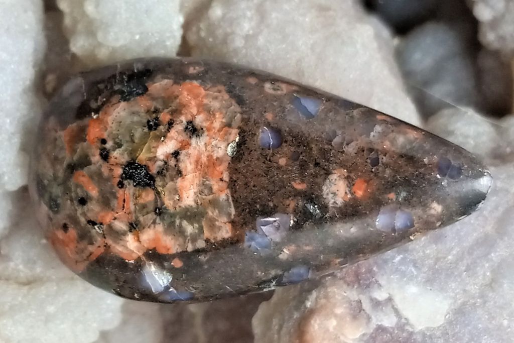 vulcanite stone on top of white quartz