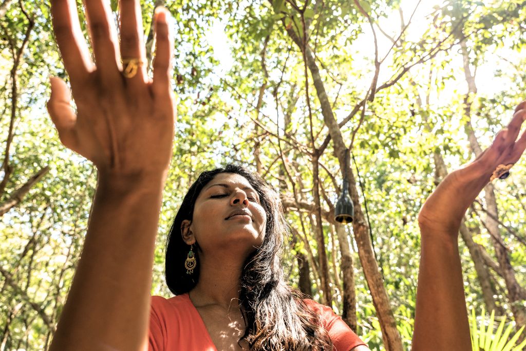 woman feeling recharged from doing meditation