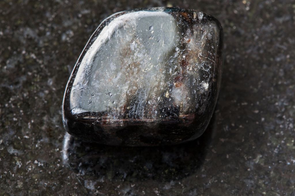 Anthophyllite Aka Nuummite on a black granite