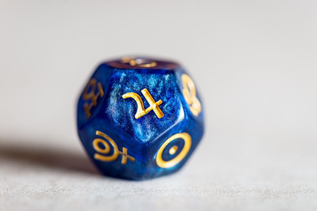 The Astrology symbol for Jupiter on a blue dice