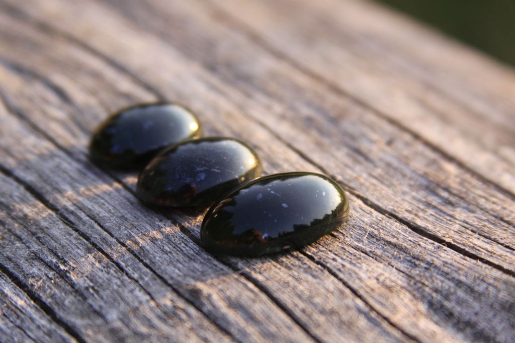 Black Jade Aka Lemurian Jade Crystals on a table