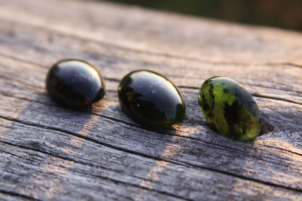 Black Jade Aka Lemurian Jade Crystals on a table