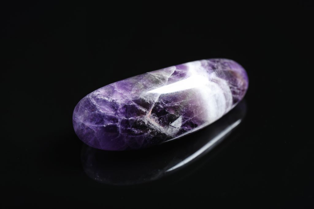 Chevron Amethyst on a black and reflective background