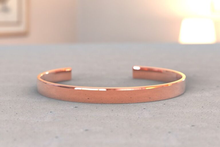 A copper bracelet on a table