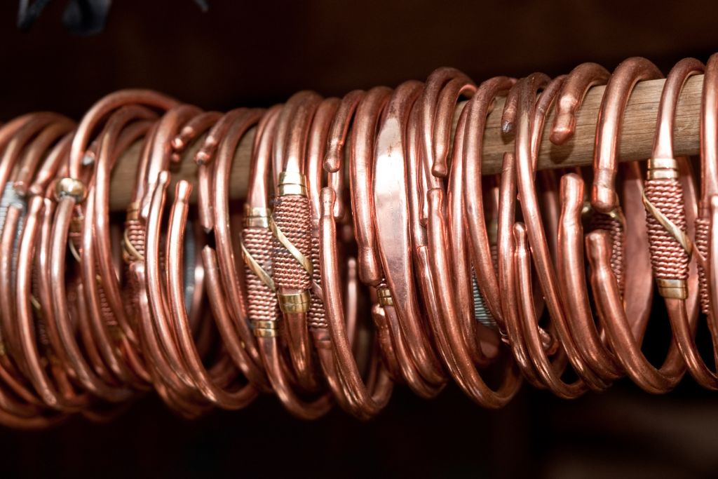 Copper bracelet hanging on a stick