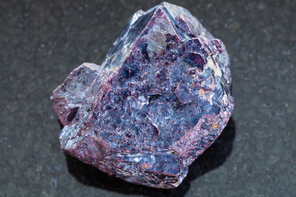 A Cuprite crystal on a black granite