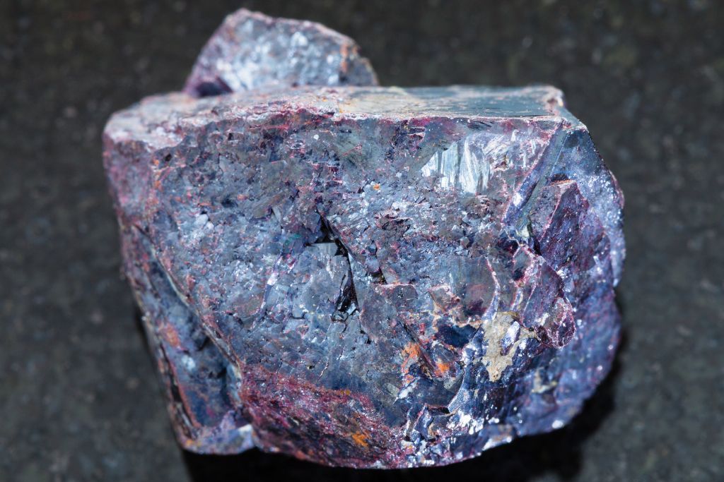 A Cuprite crystal on a black granite