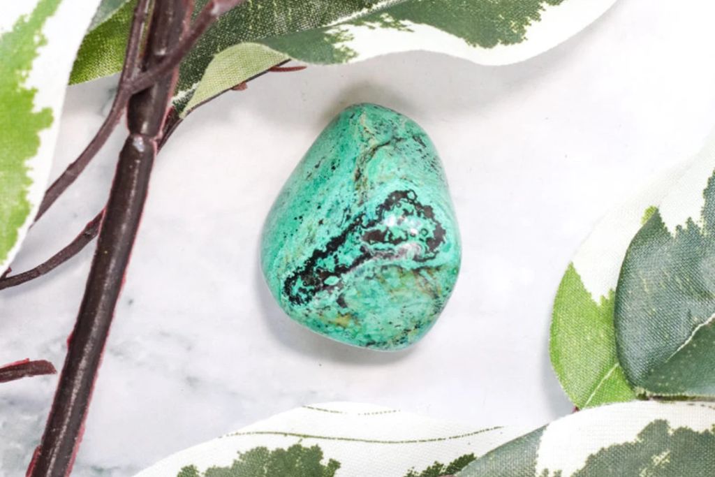 An Eilat Stone on a marble. Source: Etsy | CrystalCaveCo