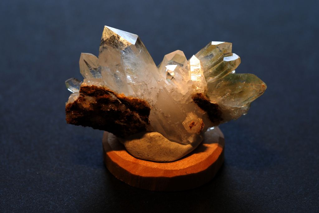 Green Chlorite Quartz on a wooden pedestal