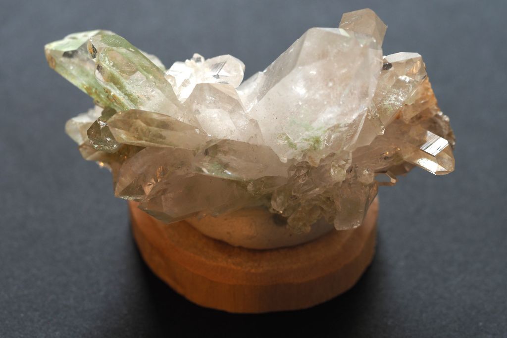 Green Chlorite Quartz on a wooden pedestal