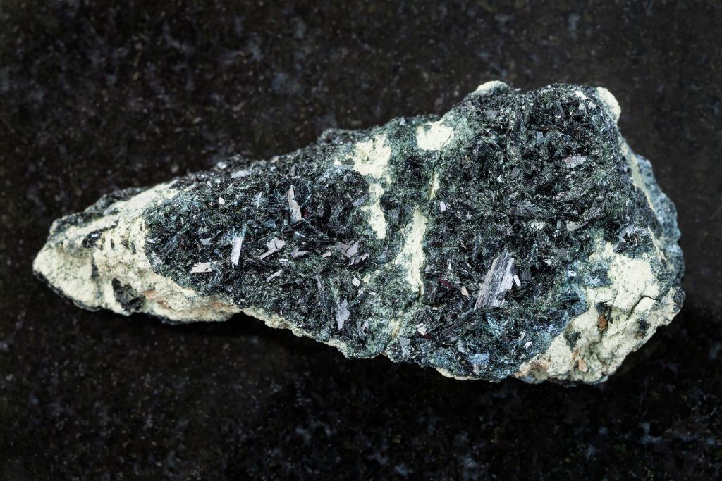 Hornblende crystal on rough amphibole rock