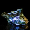 A Plancheite crystal on a black reflective background