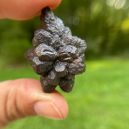 A person holding a Prophecy Stone. Source: Etsy | TheLunarFae