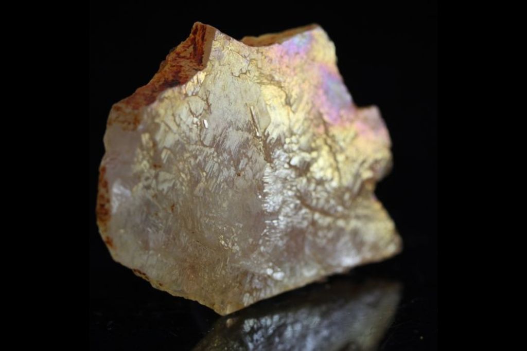 Rainbow Mayanite on a black background