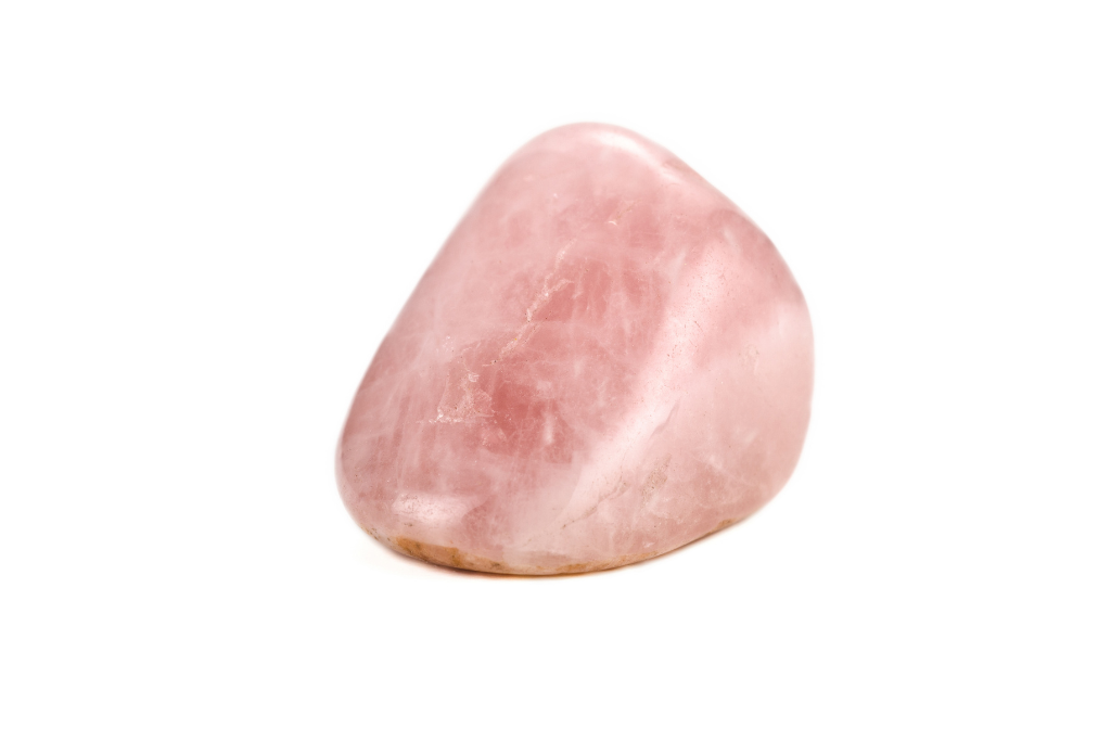 Rose quartz crystal on a white background