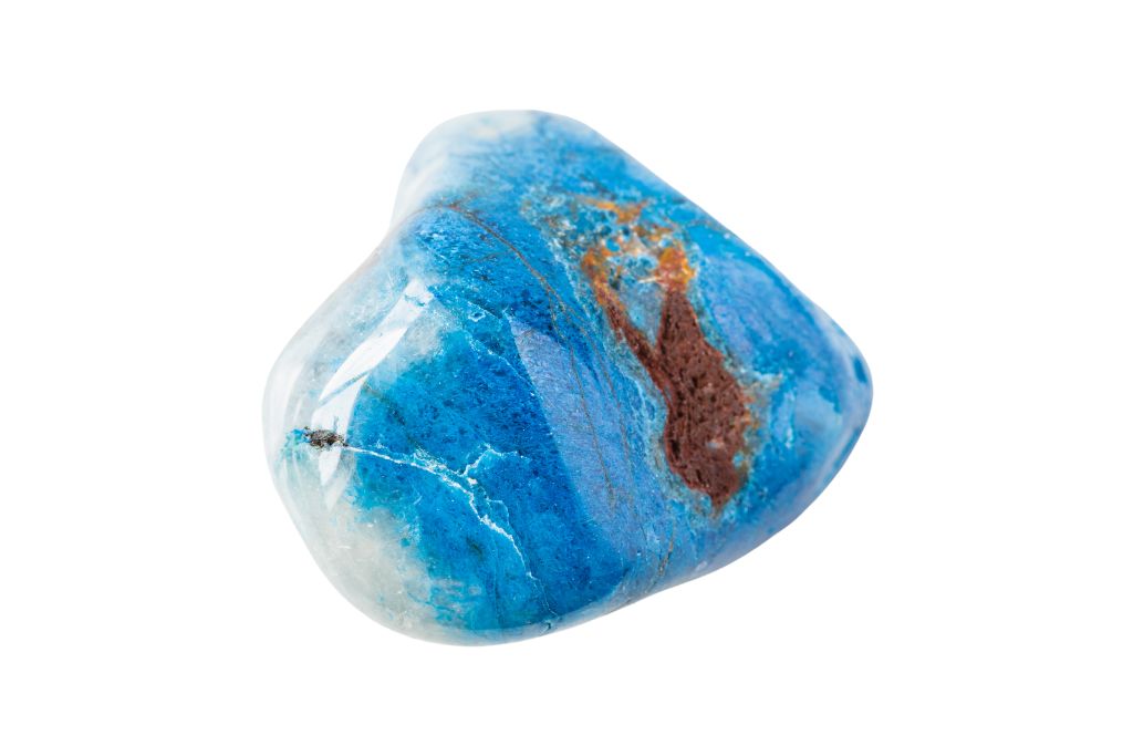 A polished Shattuckite crystal on a white background